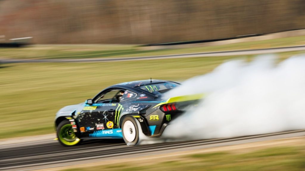 Vaughn Gittin Jr.'s 2024 Ford Mustang RTR Formula Drift car drifting rear view