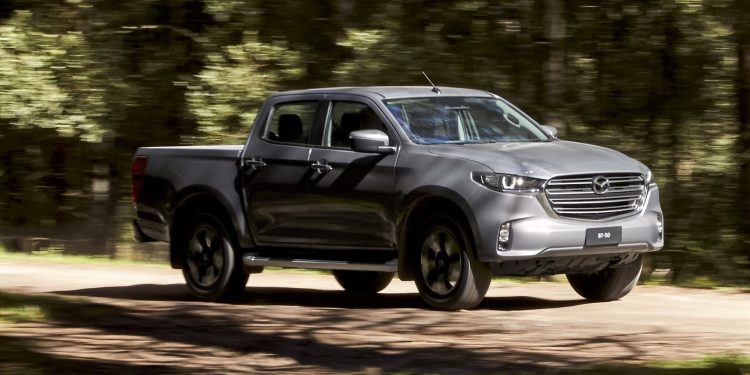 Mazda BT-50 GTX driving on dirt road