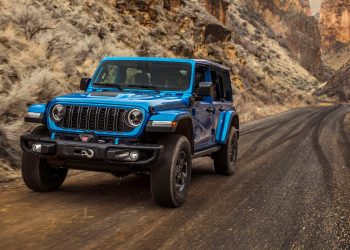 2024 Jeep Wrangler Rubicon X driving on dirt trail