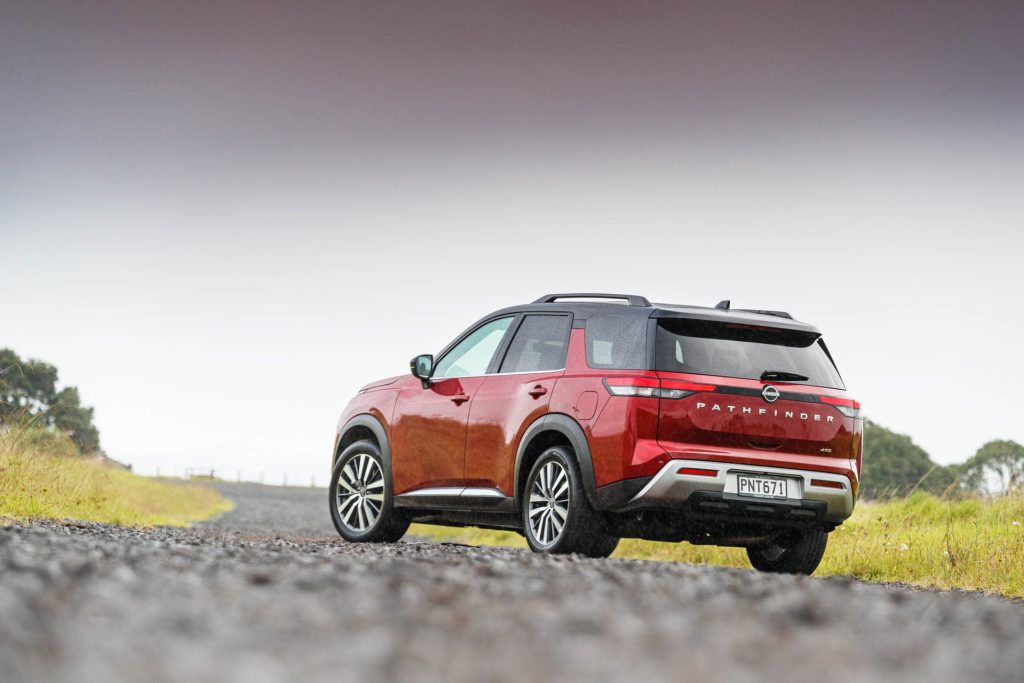 2022 Nissan Pathfinder parked on a long gravel road