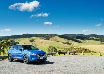 Bright blue Nissan Qashqai, parked on top of a hilltop carpark