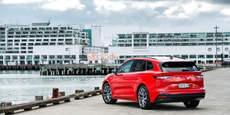 Rear quarter of the new Skoda Enyaq, pictured in red