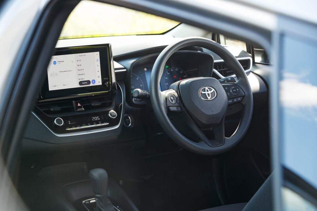 Front interior view of the Toyota GX Corolla hybrid wagon dash