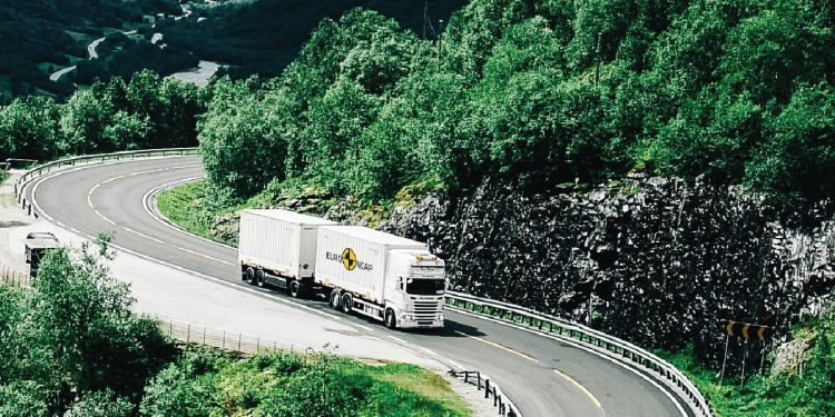 Scania truck driving on winding road