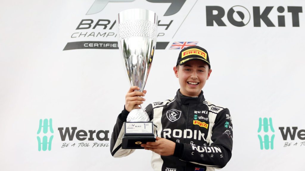 Louis Sharp holding winning British F4 trophy