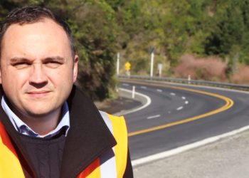 Nick Leggett, CEO of Transporting New Zealand, standing next to road