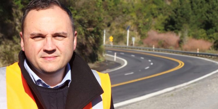 Nick Leggett, CEO of Transporting New Zealand, standing next to road