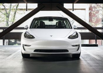 Tesla Model 3 front view in car park