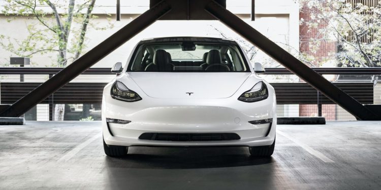Tesla Model 3 front view in car park