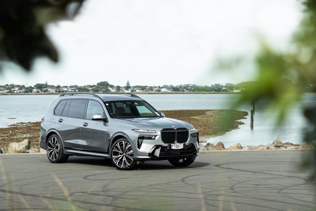 BMW X7 parked at a marina