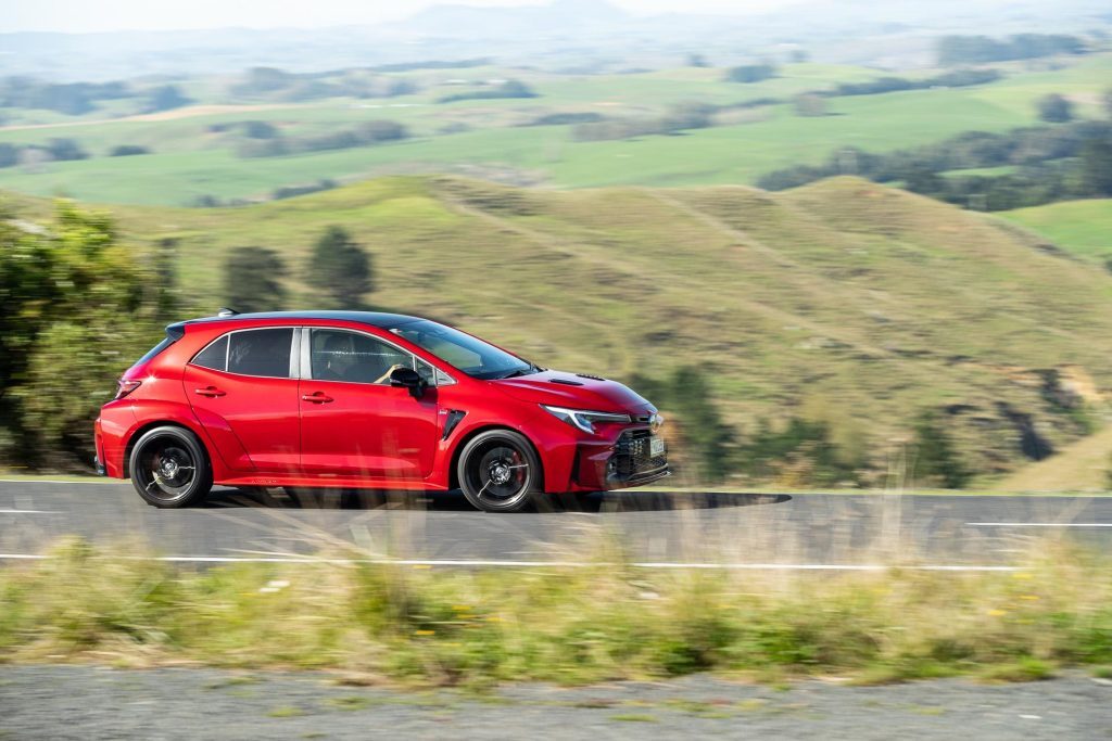 Toyota GR Corolla driving on country road