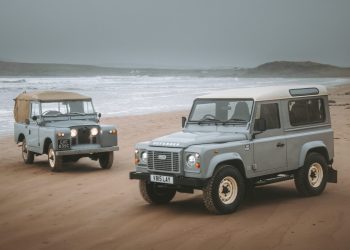 Land Rover Defender Works V8 Islay Edition on beach with original Series 2a