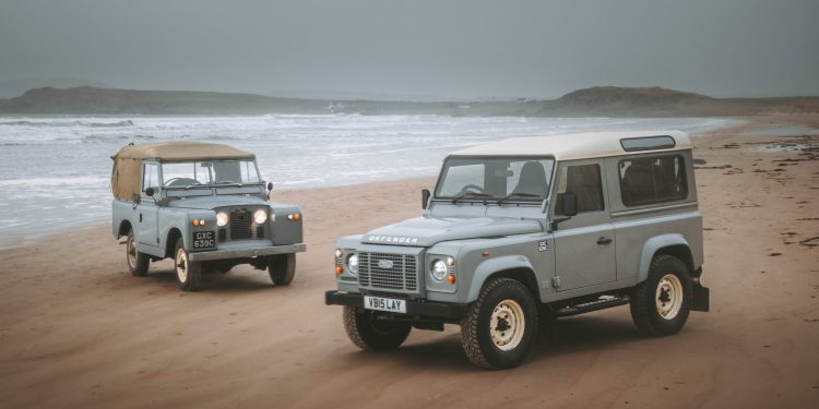 Land Rover Defender Works V8 Islay Edition on beach with original Series 2a