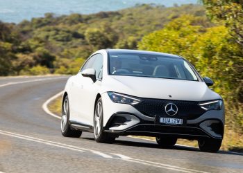 Mercedes-Benz EQE 350 4Matic+ driving along coastal road