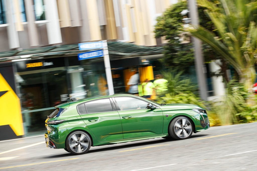 Peugeot 308 GT PHEV in the city streets taking a corner