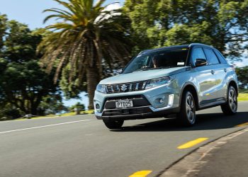 Blue Suzuki Vitara Hybrid taking a corner