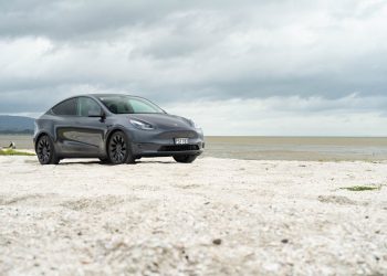 Tesla Model Y Performance parked on white sand