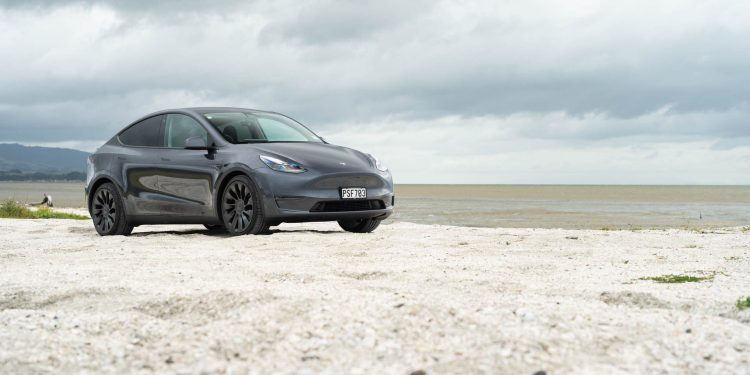 Tesla Model Y Performance parked on white sand