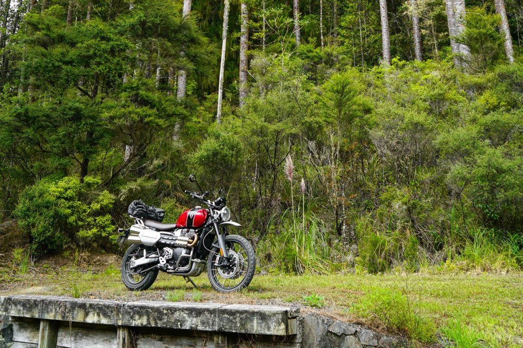 Triumph Scrambler XC 1200 on a retaining wall
