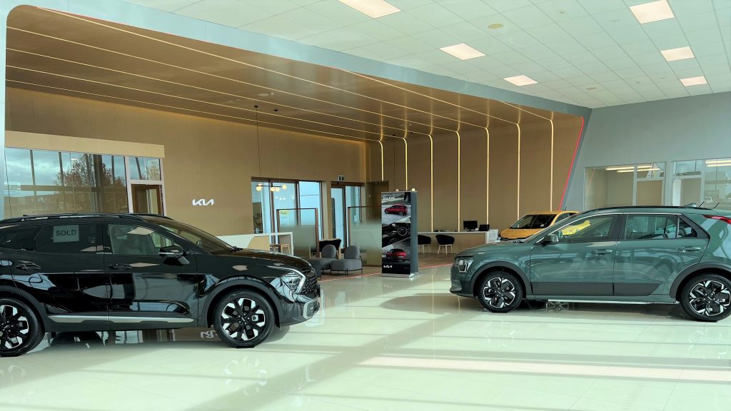 Cars inside of new Kia North Shore dealership
