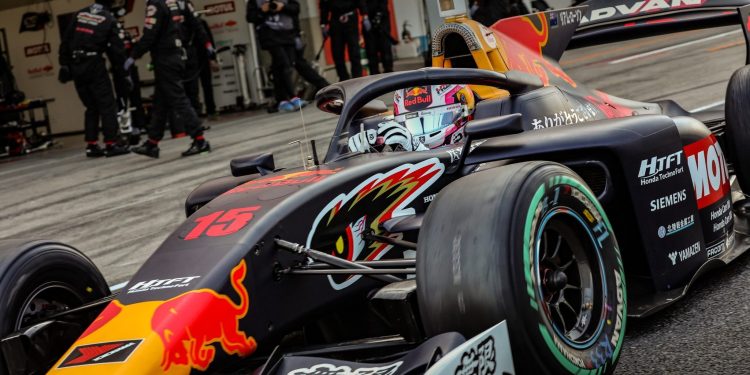 Liam Lawson driving Super Formula car in pit lane