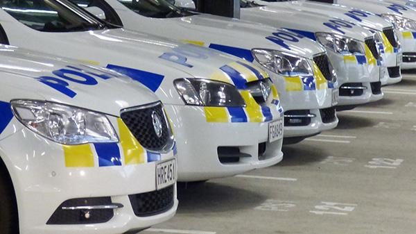 Multiple New Zealand Police cars in a line
