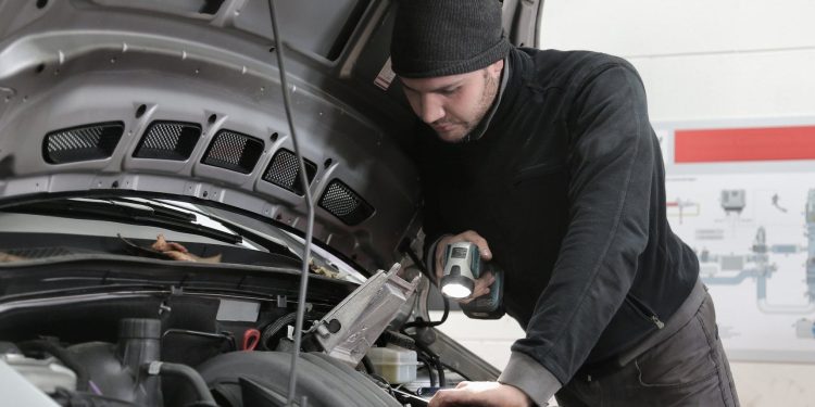 Mechanic working on car