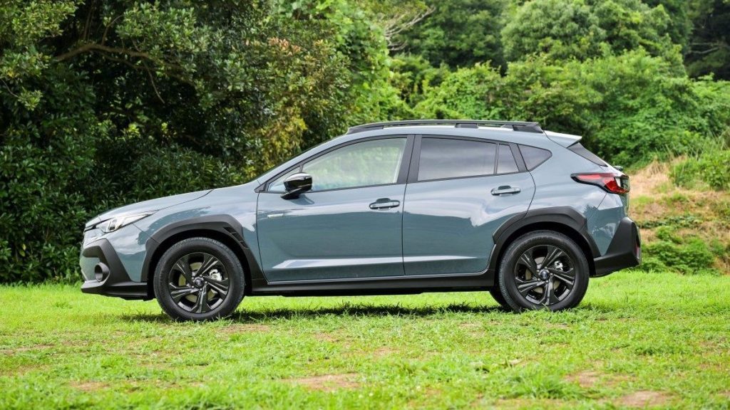 Subaru Crosstrek side profile by trees