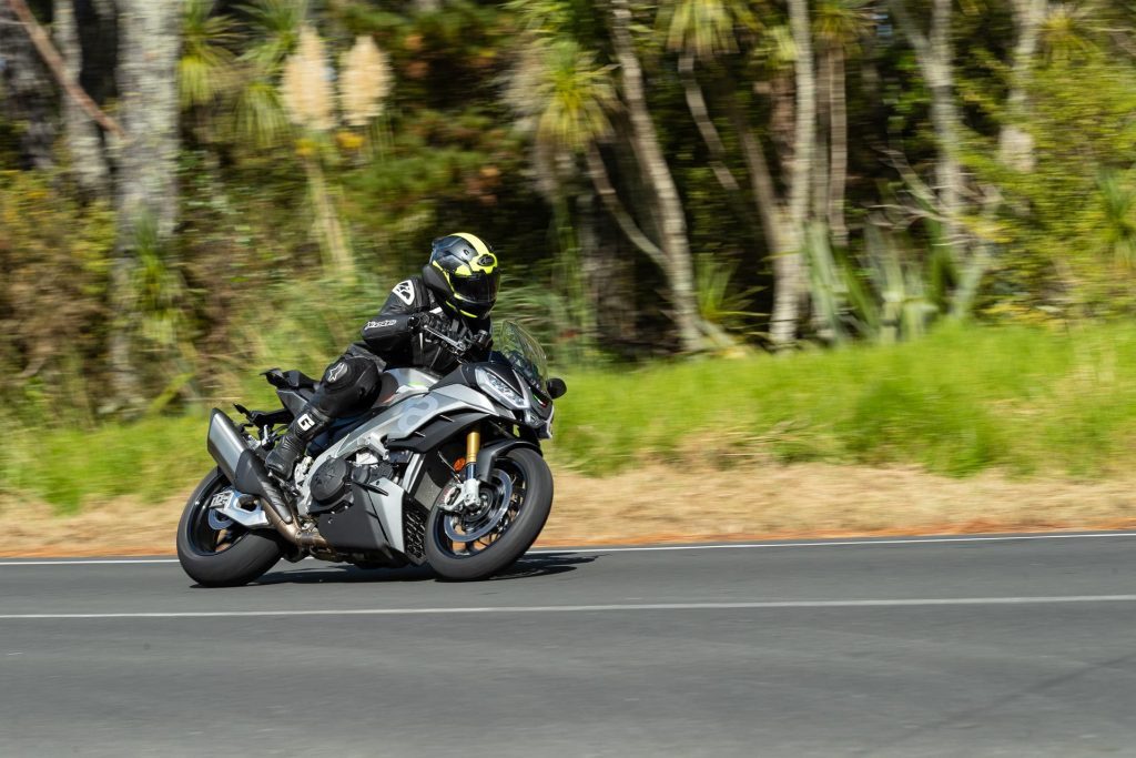 Aprilia Tuono V4 1100 action shot, driving past on a corner