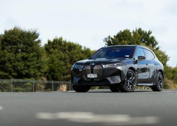 BMW iX M60 parked in a carpark from a front quarter angle