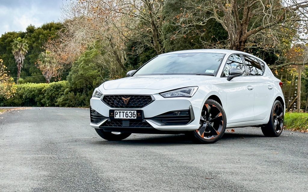 Cupra Leon V parked by trees