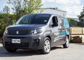 Peugeot e Partner Van with wood ready to be loaded behind it