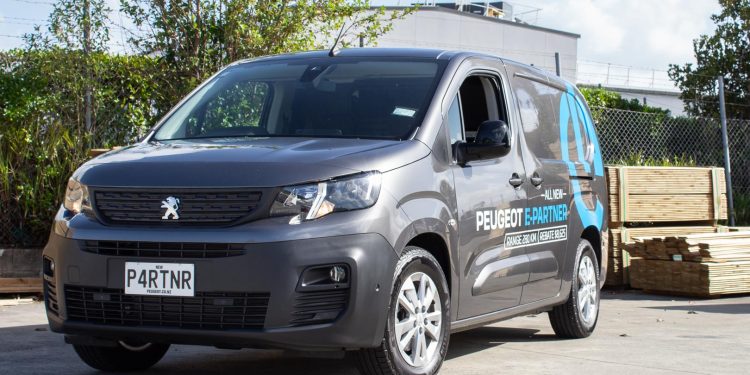 Peugeot e Partner Van with wood ready to be loaded behind it