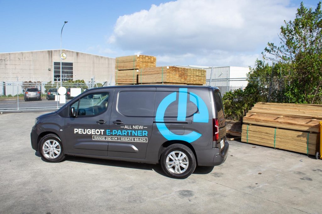 Peugeot e-Partner van side shot with van branding 