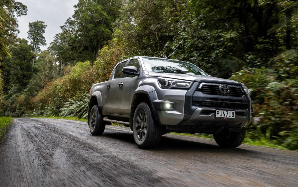 Toyota Hilux driving on gravel road