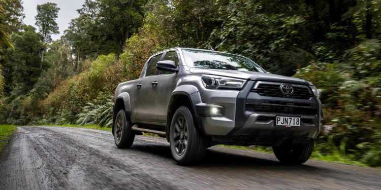 Toyota Hilux driving on gravel road