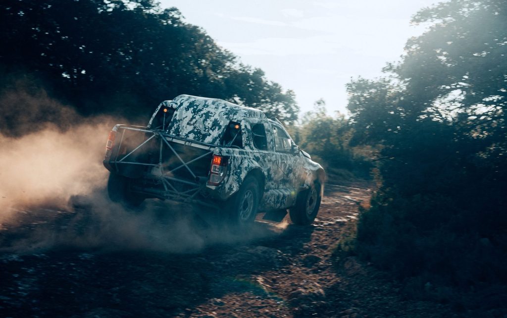 Ford Ranger T1+ racing on dirt road