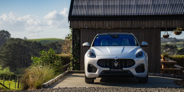 Maserati Grecale parked in front of house in countryside