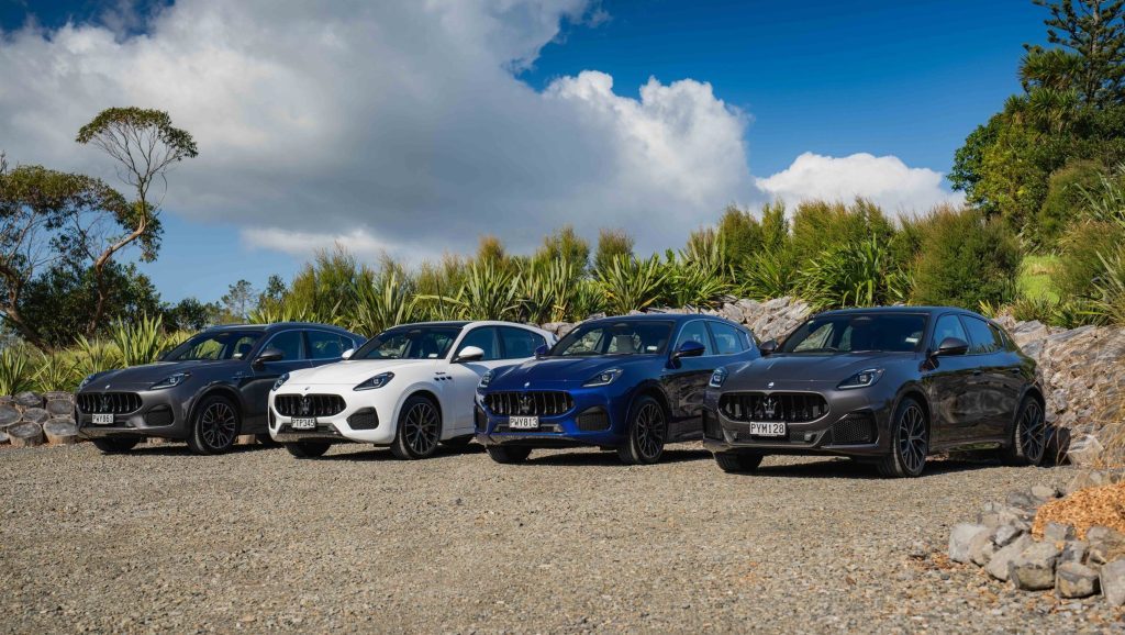 Line up of Maserati Grecales by trees