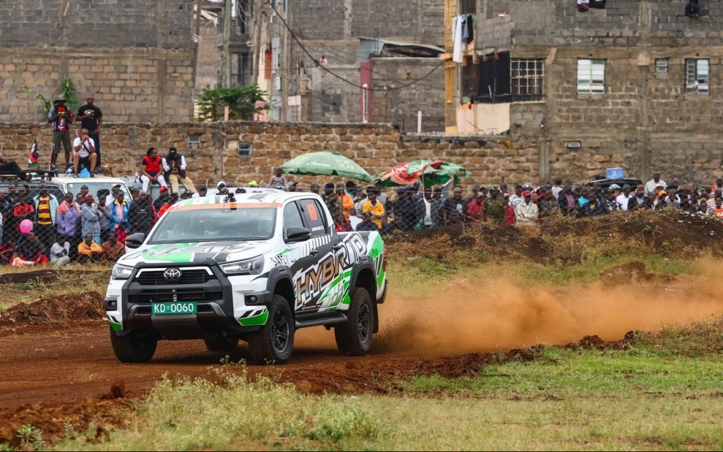 Toyota Hilux hybrid drifting on dirt road in Africa