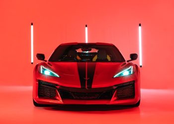 Red Corvette Z06 2023 shot in a red lit studio