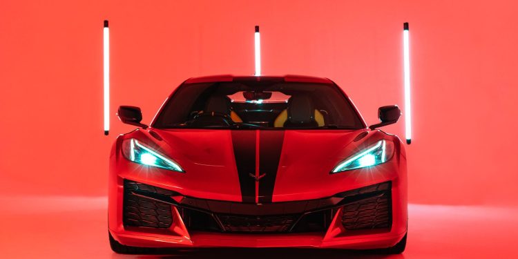 Red Corvette Z06 2023 shot in a red lit studio