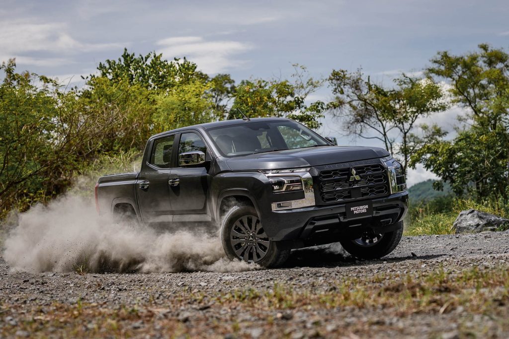 2024 Mitsubishi Triton driving on gravel road