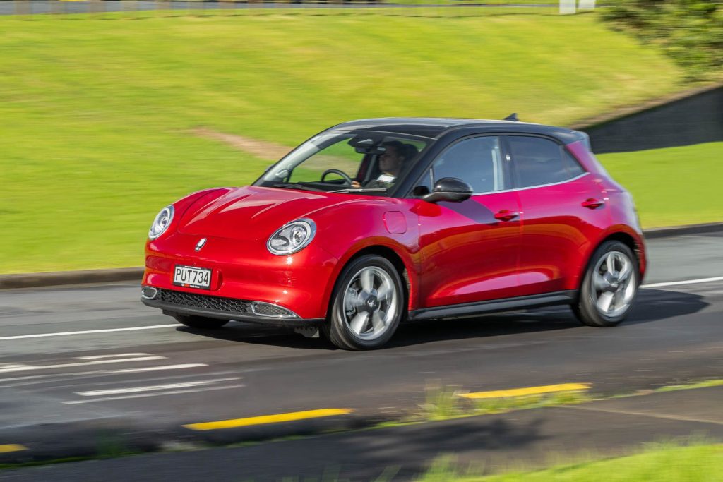 Great Wall Motors Ora, in red driving on Auckland roads