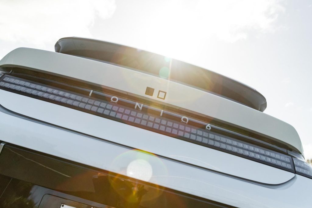 Sun shining over the rear badging of the IONIQ 6