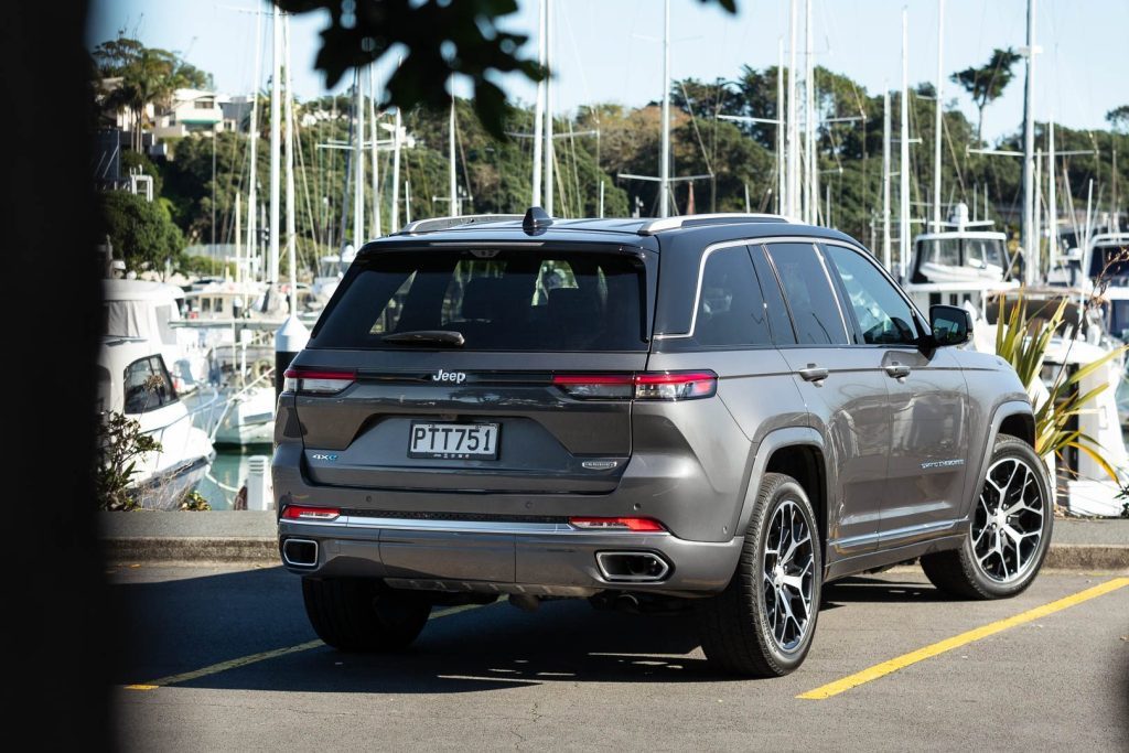 Rear shot of the Jeep Grand Cherokee 4xE Summit Reserve in the sun