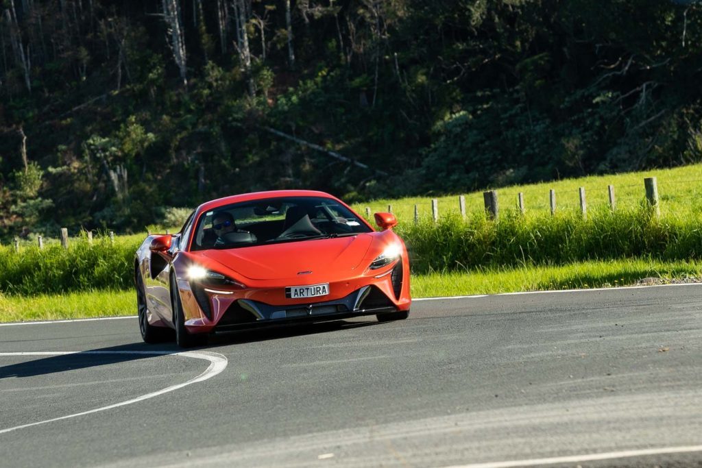 McLaren Artura taking a corner, front on shot