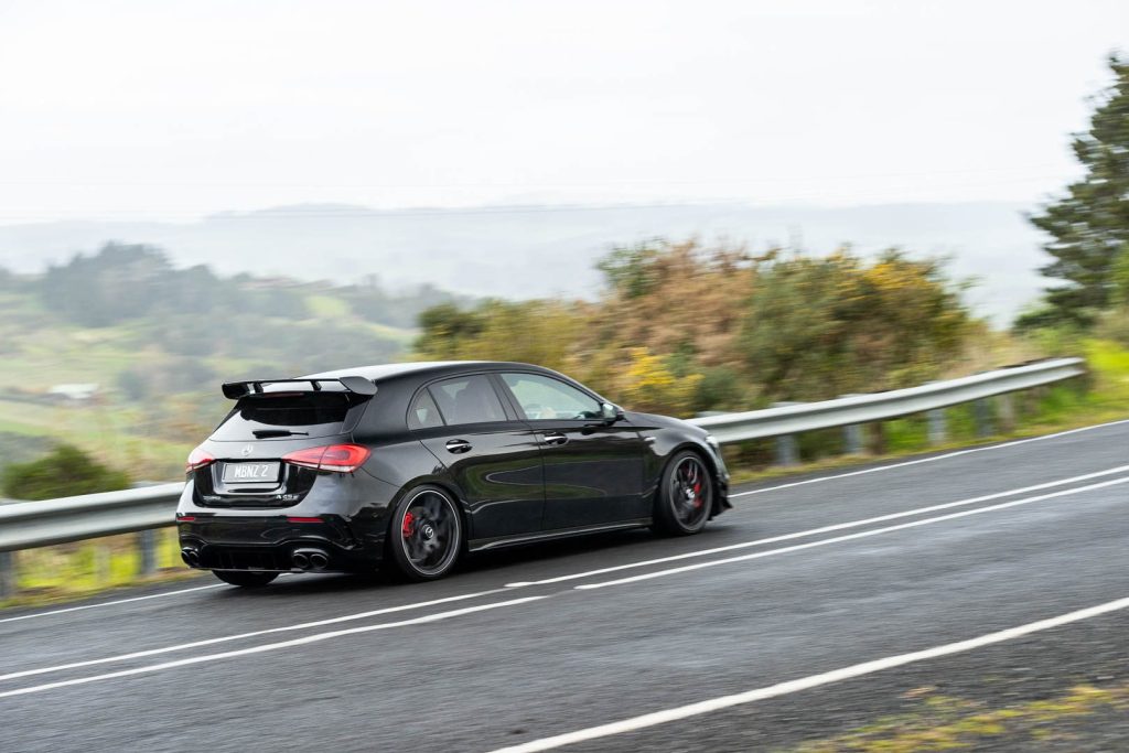 Mercedes AMG A45 S taking a corner in the rain