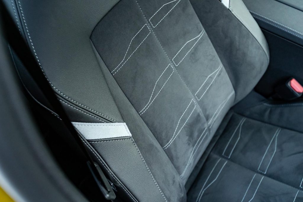 Seat stitching detail shot, showing multiple textures
