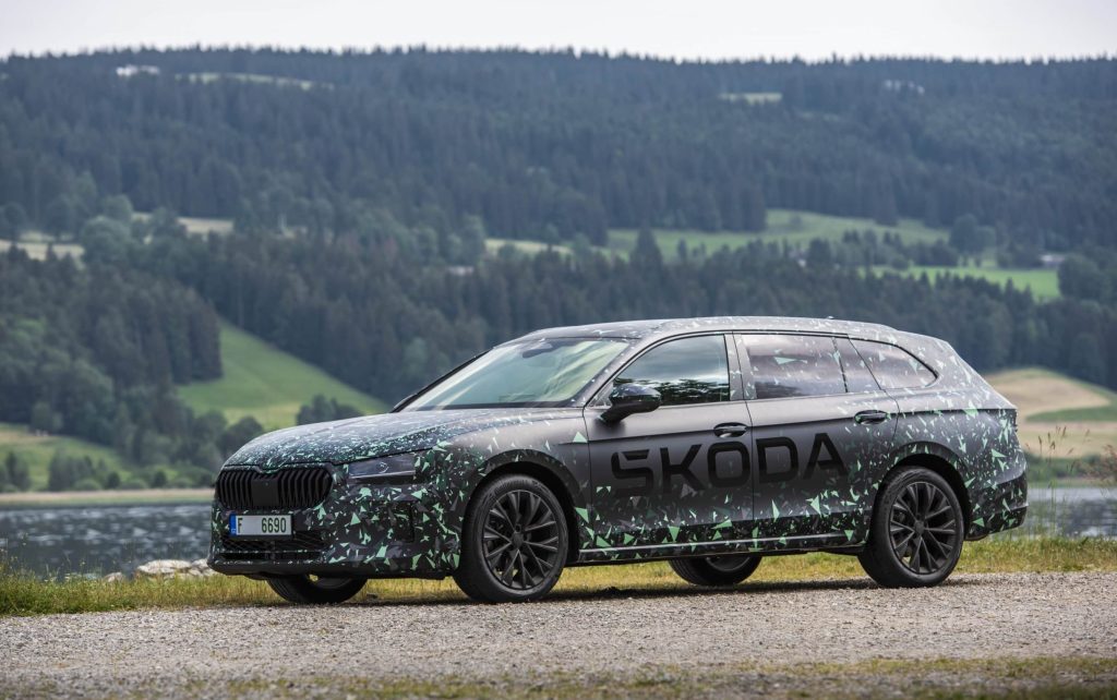 Skoda Superb parked by forest